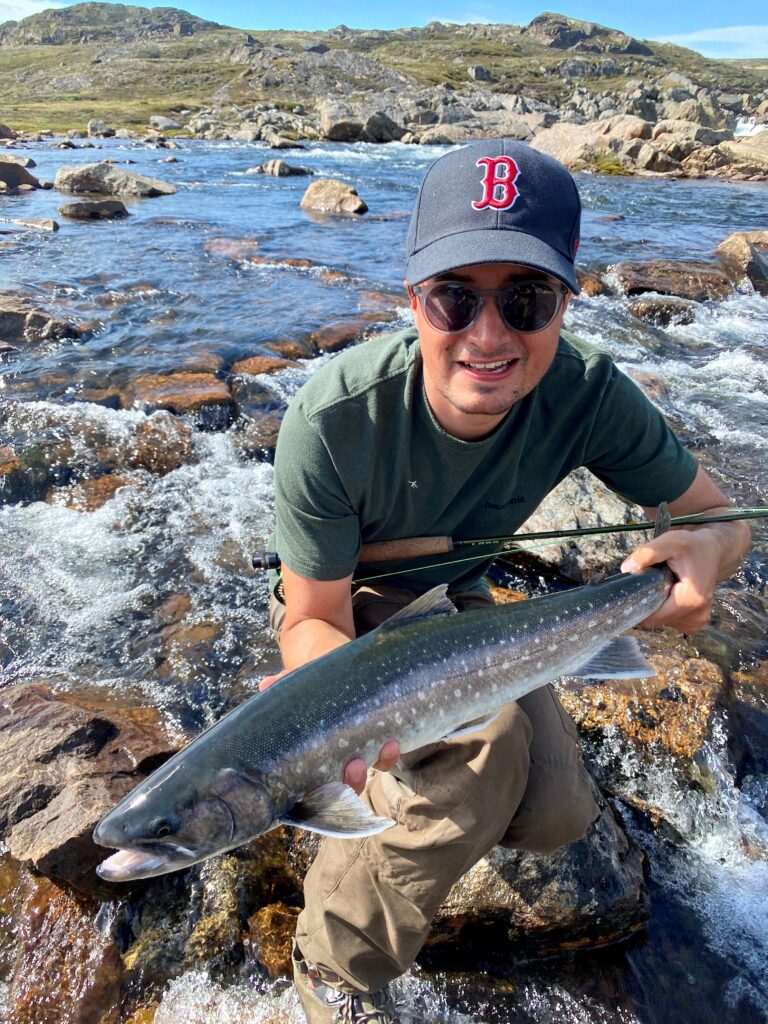 Happy customer with his catch. Photo by Andreas Stocker